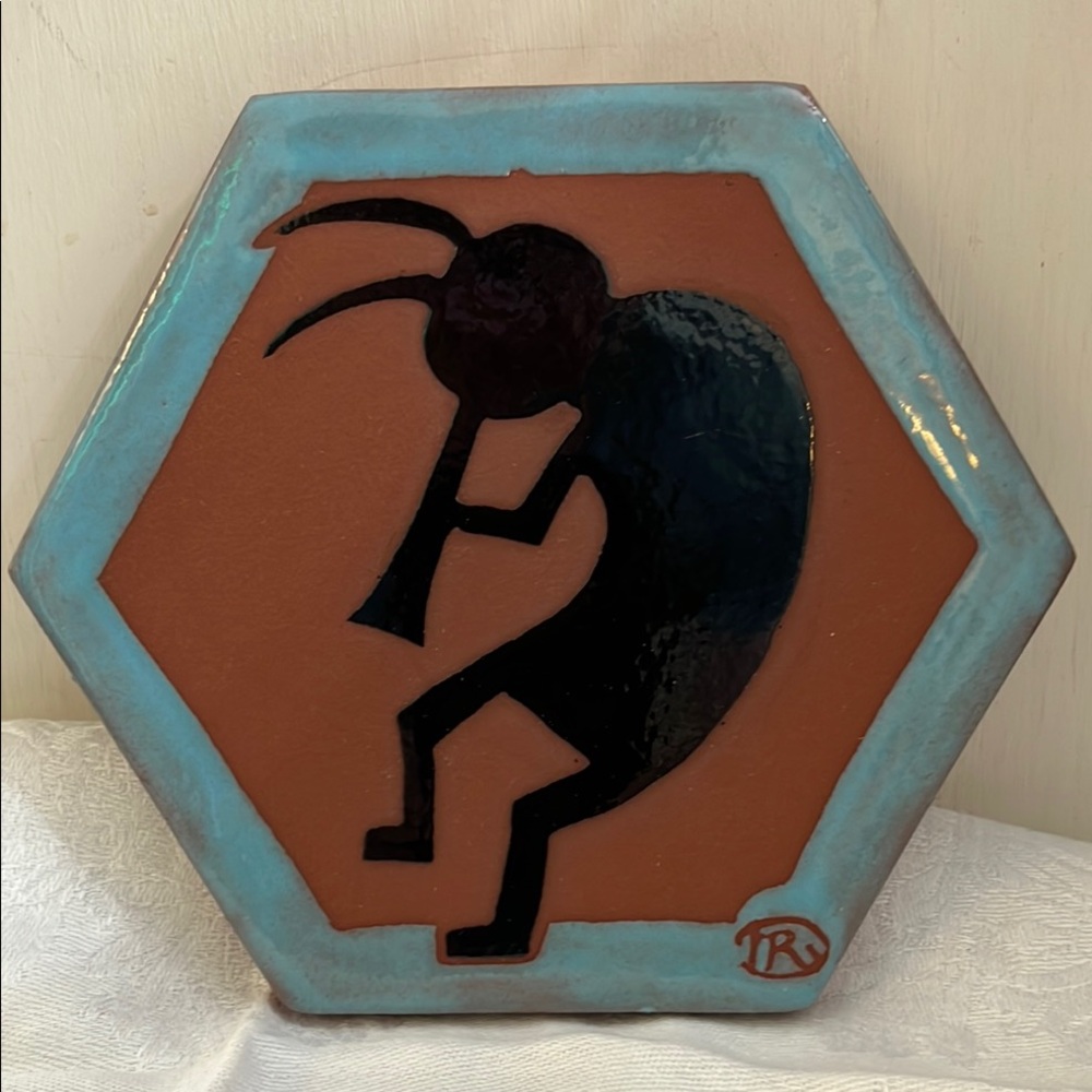 Hexagonal Ceramic Tile with Kokopelli Design